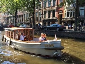 romantic canal boat amsterdam- good time to visit in summar