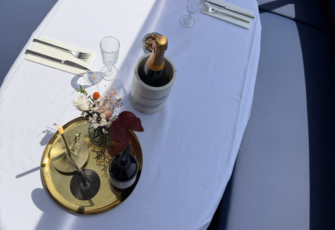 Boutique saloon boat table setting, private canal cruise Amsterdam