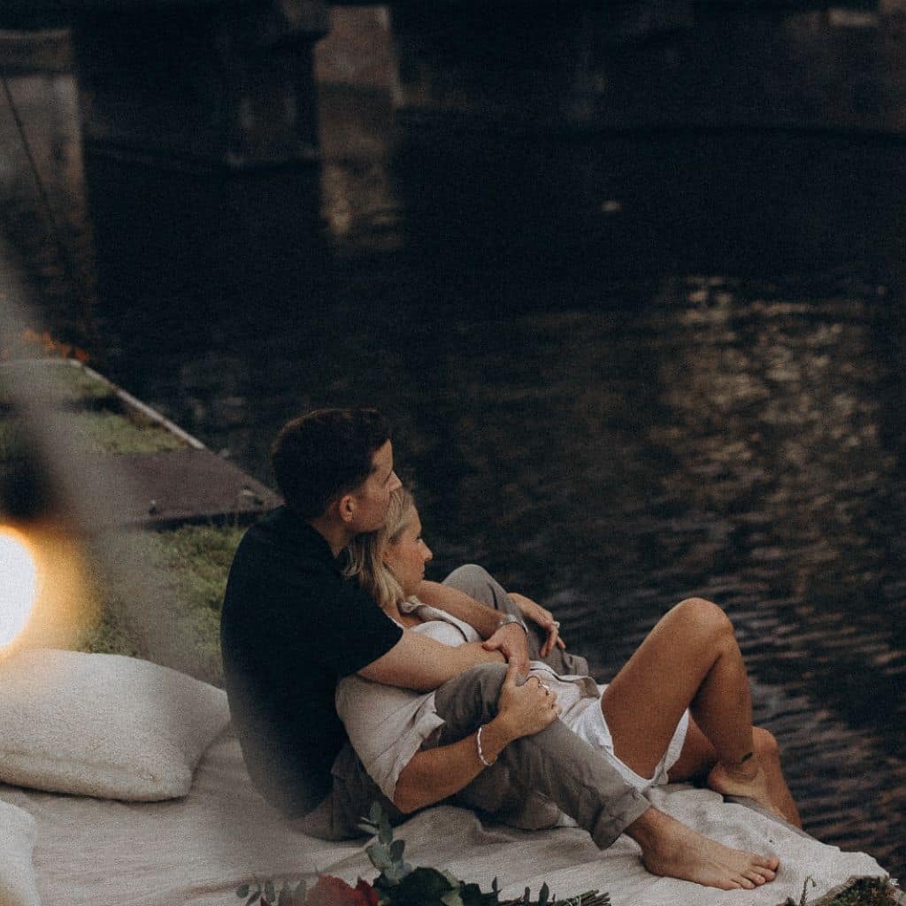 couple sharing romantic moments along the Prinsengracht Canal