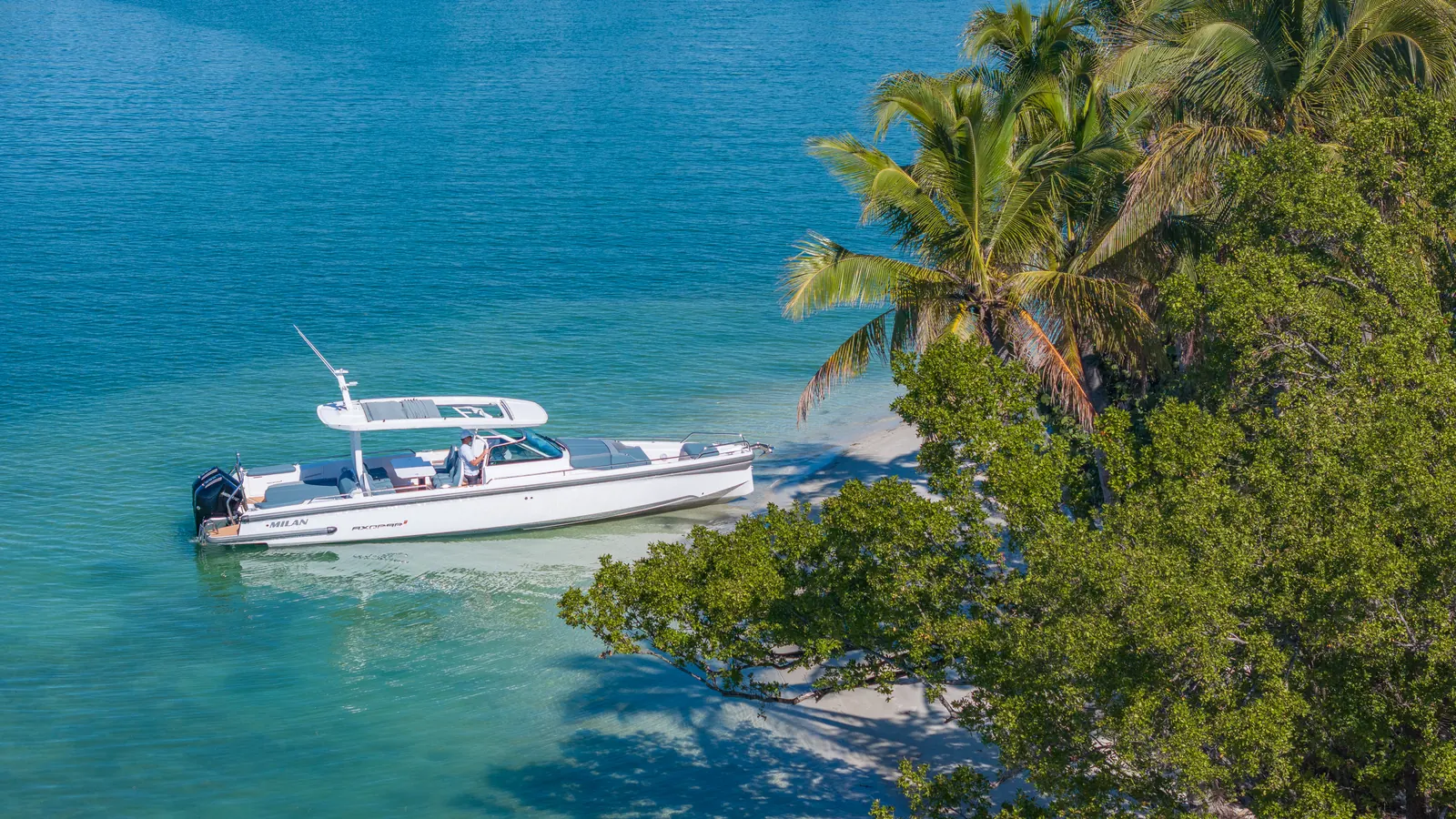 Private boat from Miami to Bimini aboard the 38' Axopar "Four Keeps" day boat, crossing under a Miami bridge