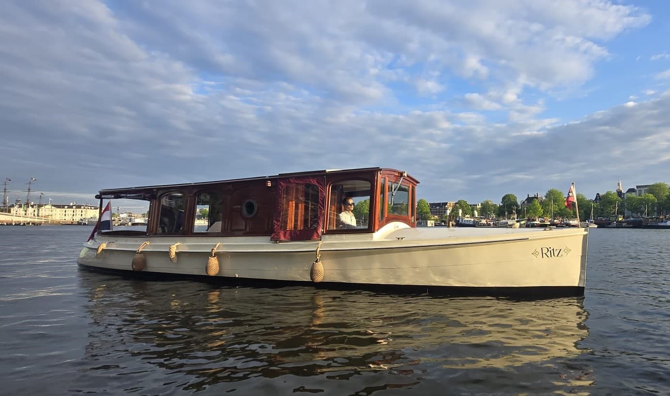 Side rear view of the Ritz on an Amsterdam canal